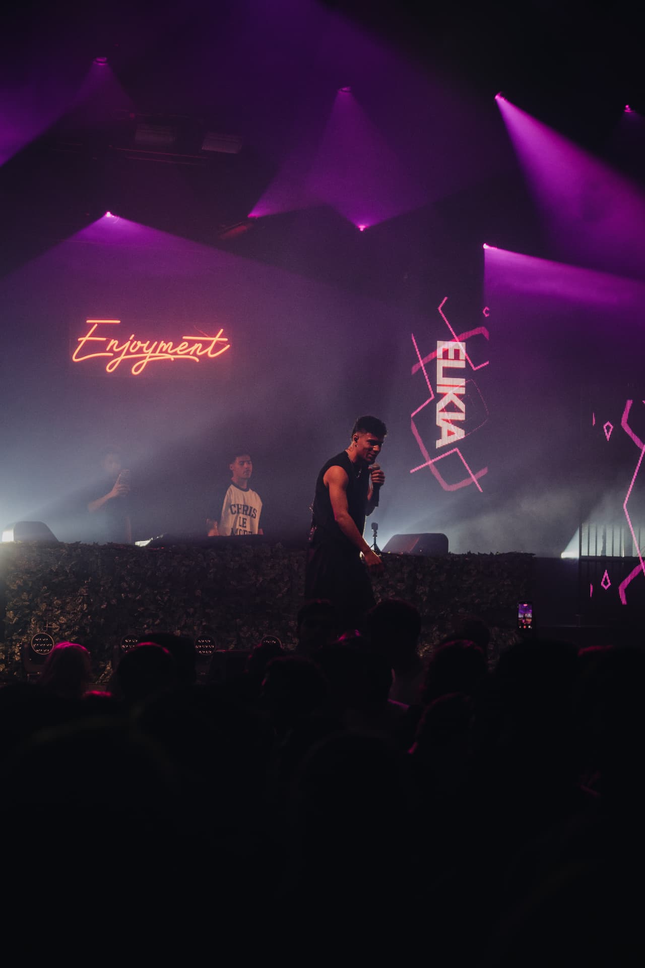 ELIKIA on stage under purple lights