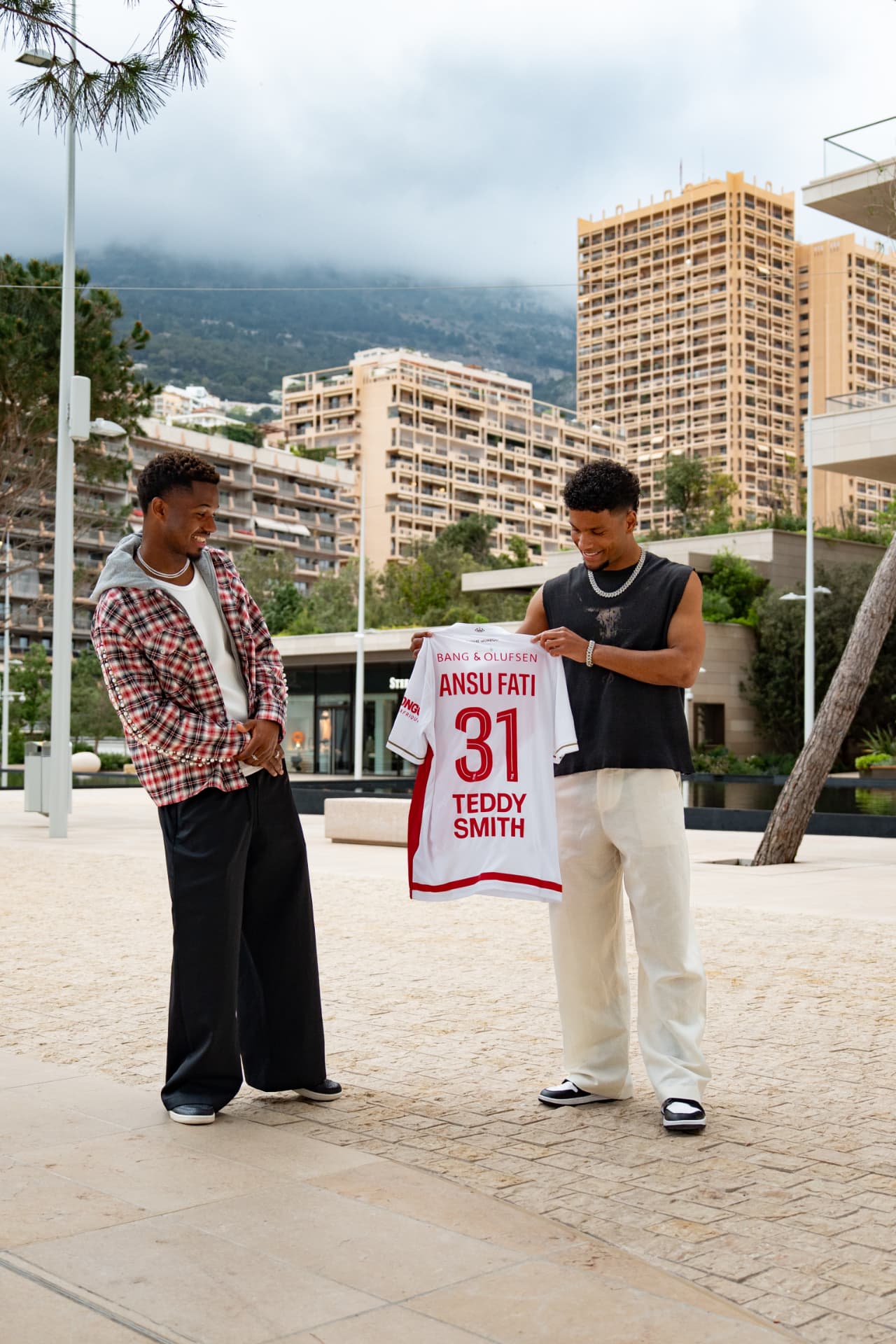 ELIKIA with Ansu Fati holding a signed number 31 football shirt